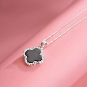 necklace in black featuring clover pendant and straight fit