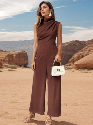 Brown draped neckline wide-leg jumpsuit with a sleeveless design and high neck.