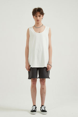 White sleeveless scoop neck tank top with raw hem
