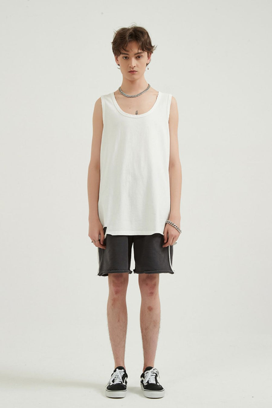 White sleeveless scoop neck tank top with raw hem
