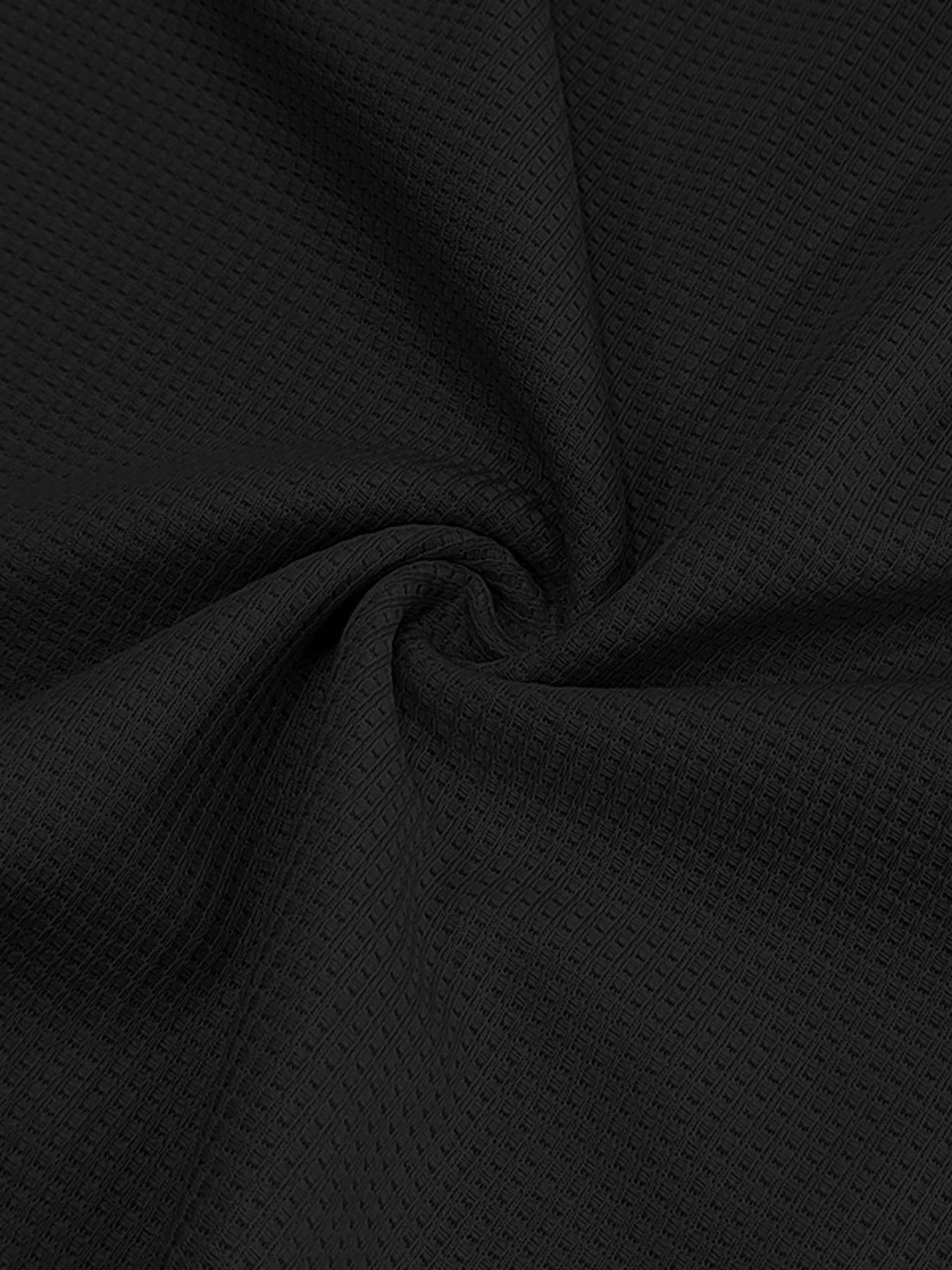 Black cotton t-shirt fabric with a waffle knit texture.
