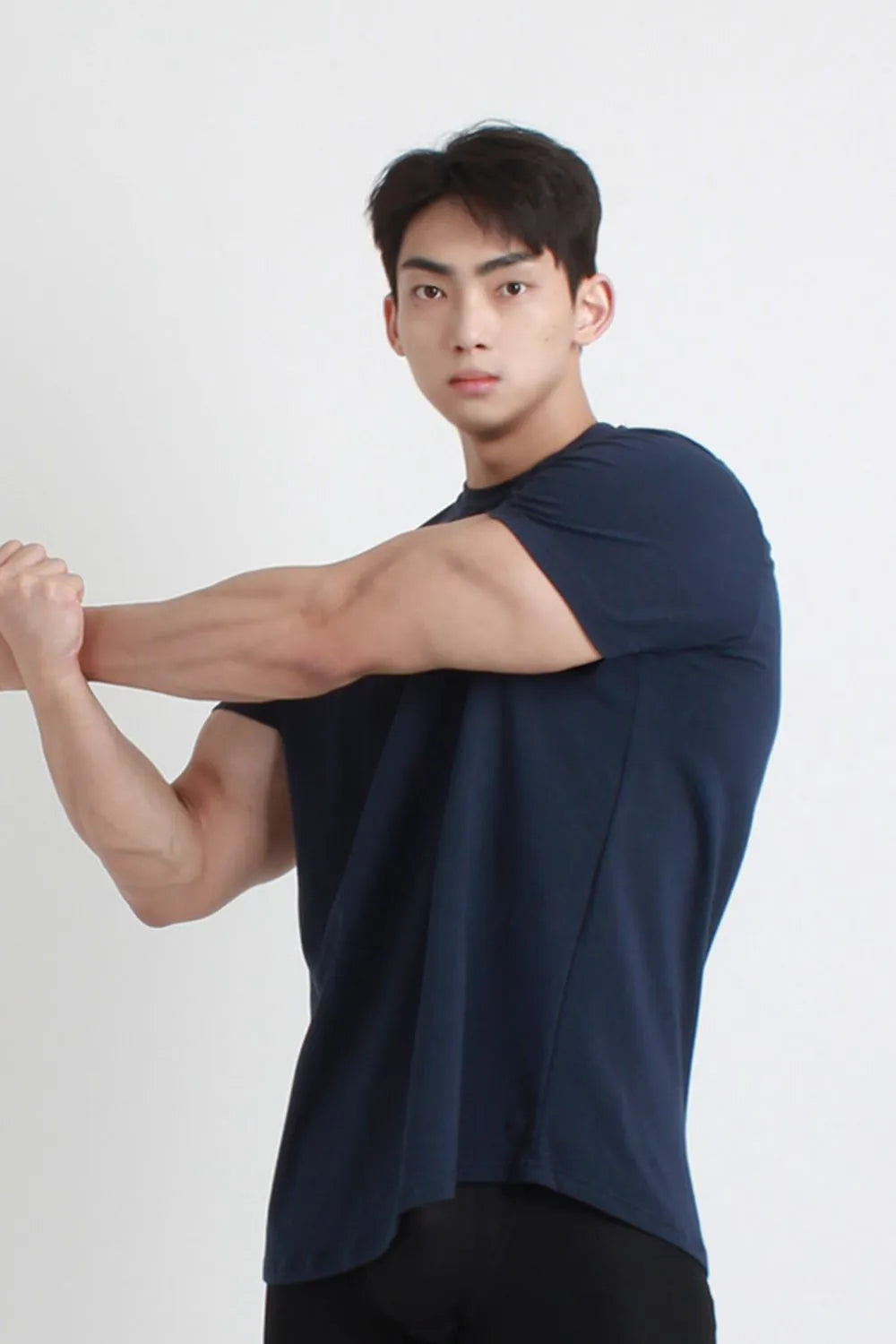 Navy performance tee with sculpted hemline and crew neck
