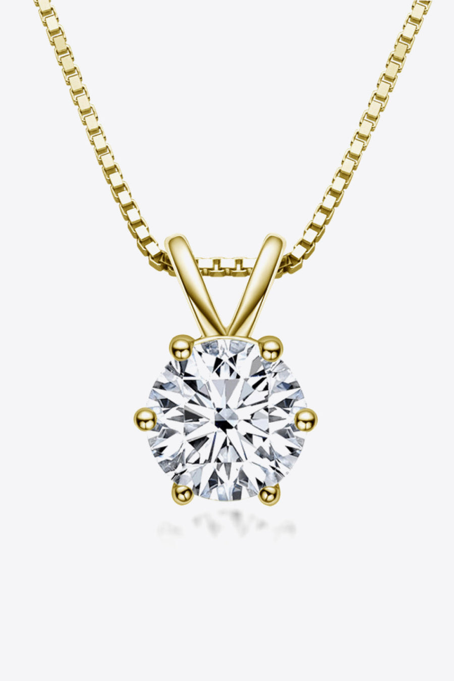 Gold moissanite pendant necklace with 1 carat round brilliant cut stone on a box chain.