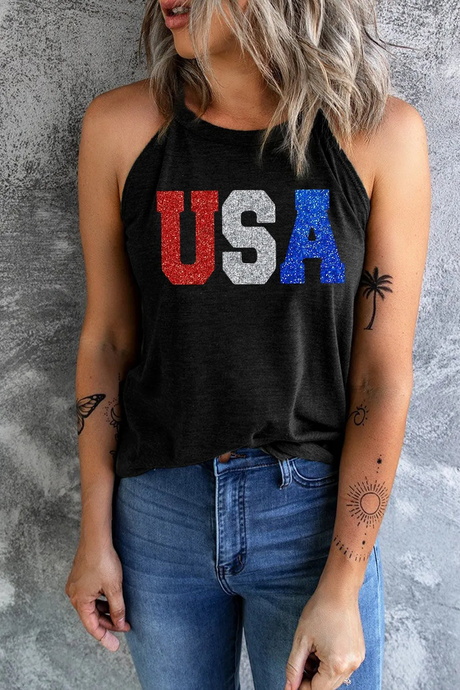 Black halter tank top with glitter USA graphic in red, white, and blue.