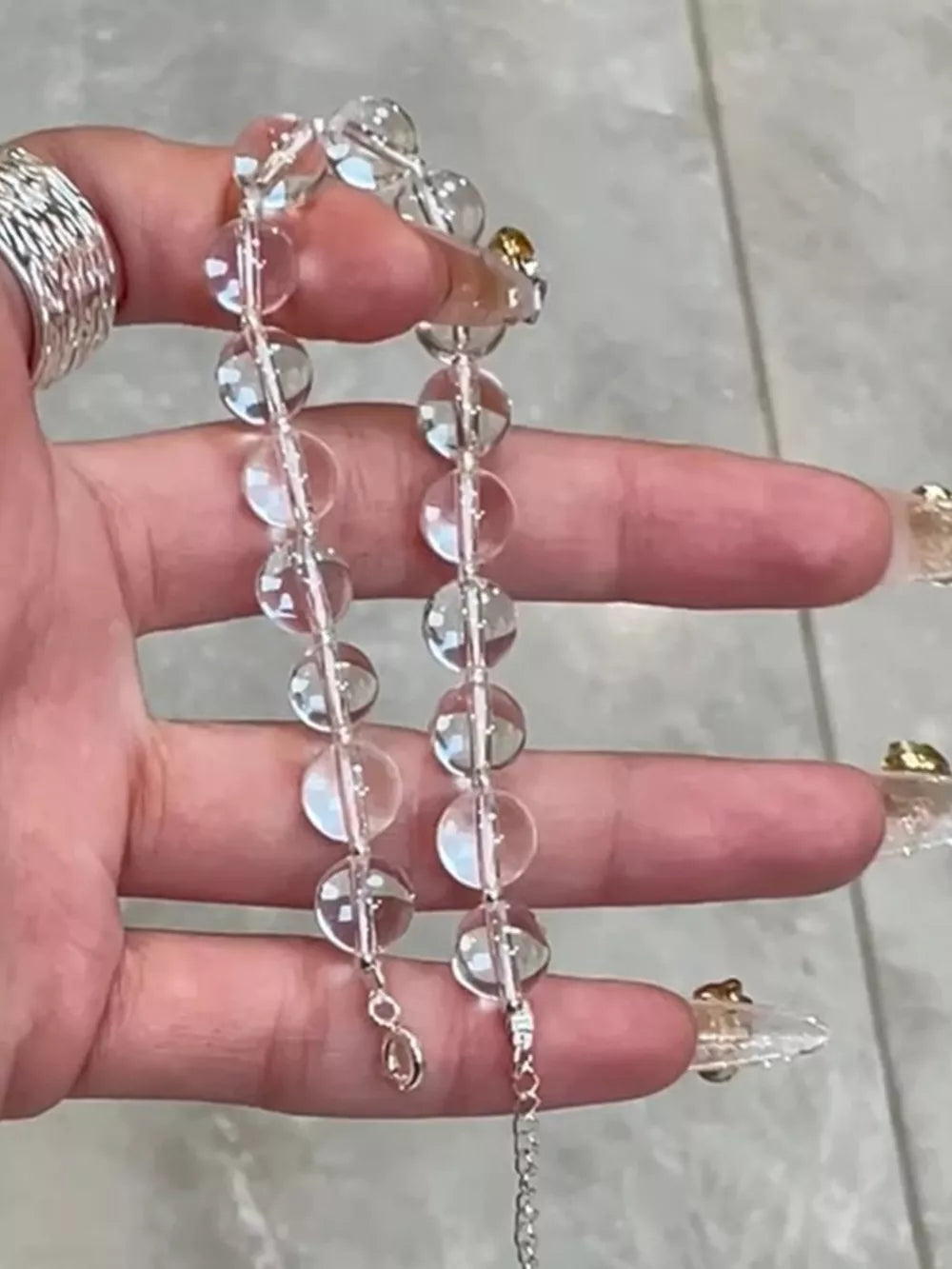 Radiant Crystal Bead Silver Bracelet with clear beads and adjustable chain.