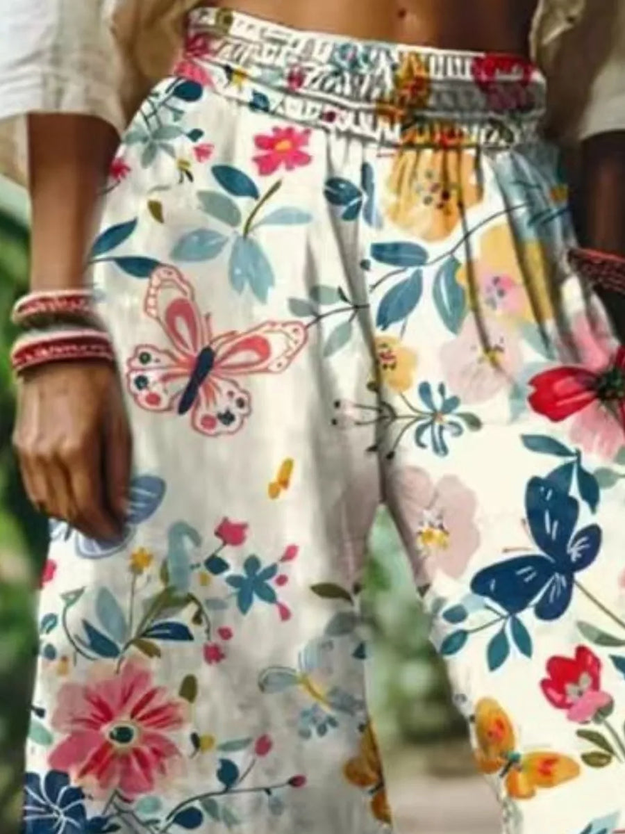 pink wide-leg pants featuring elastic waist and floral