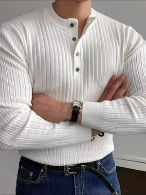 White ribbed knit henley sweater with button accents and long sleeves.