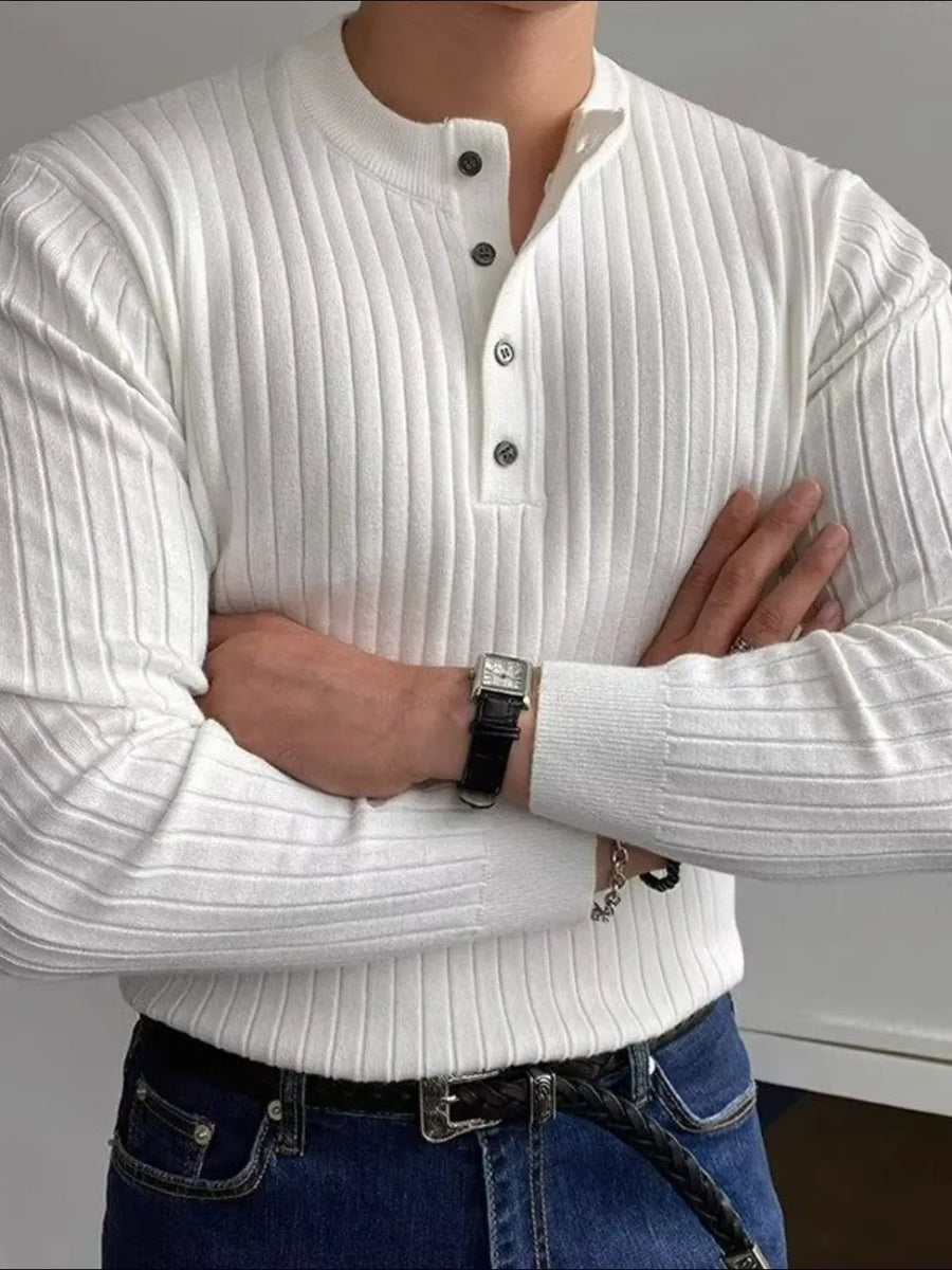 White ribbed knit henley sweater with button accents and long sleeves.