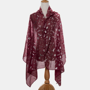Burgundy Christmas print metallic scarf with reindeer and snowflake patterns.