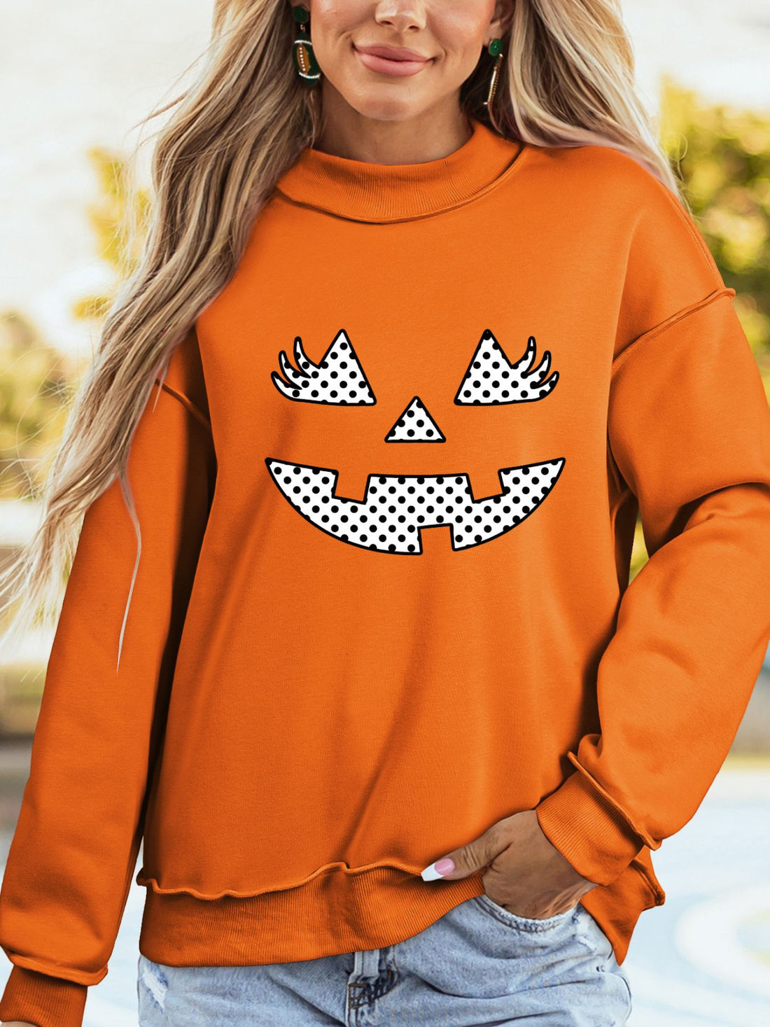 orange sweatshirt with polka dot and mock neck