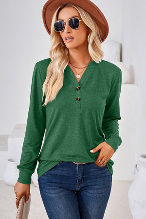 Dark green henley knit top with button detail and long sleeves.