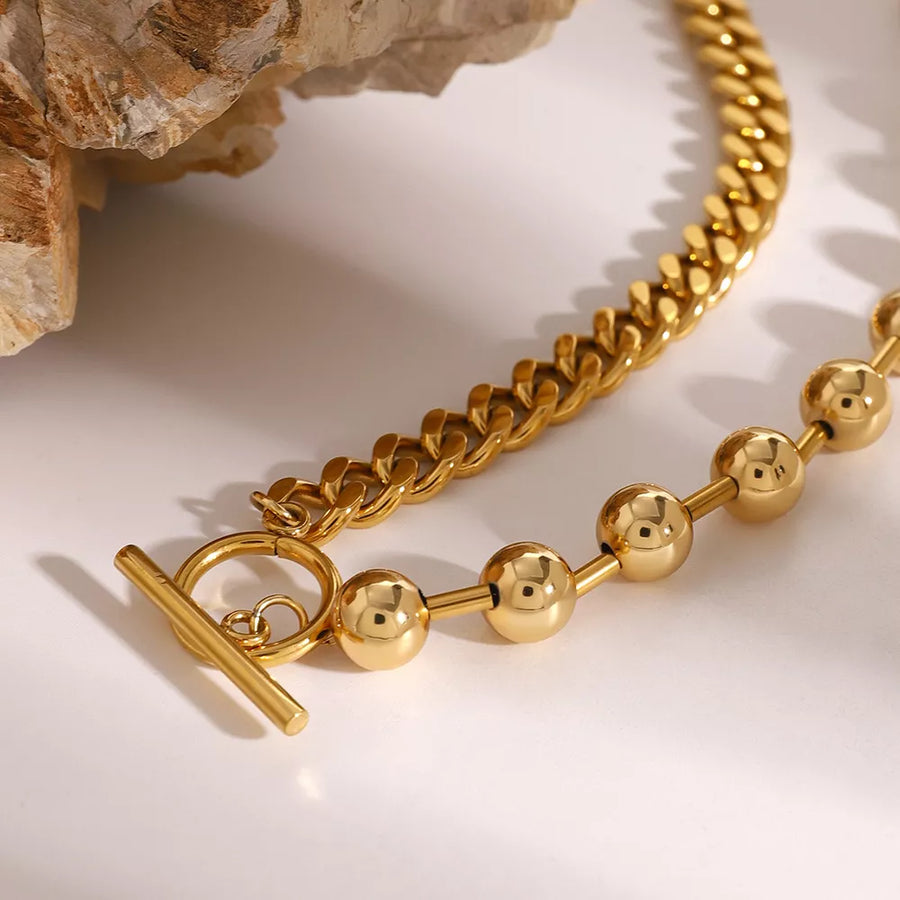 Gold necklace featuring 18K gold-plated and chain link