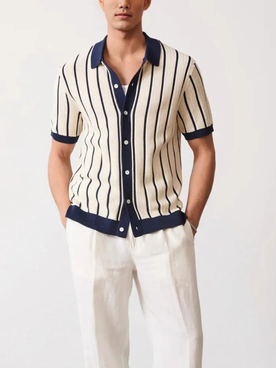 Textured stripe knit polo shirt in navy and cream with contrast trim and buttons.