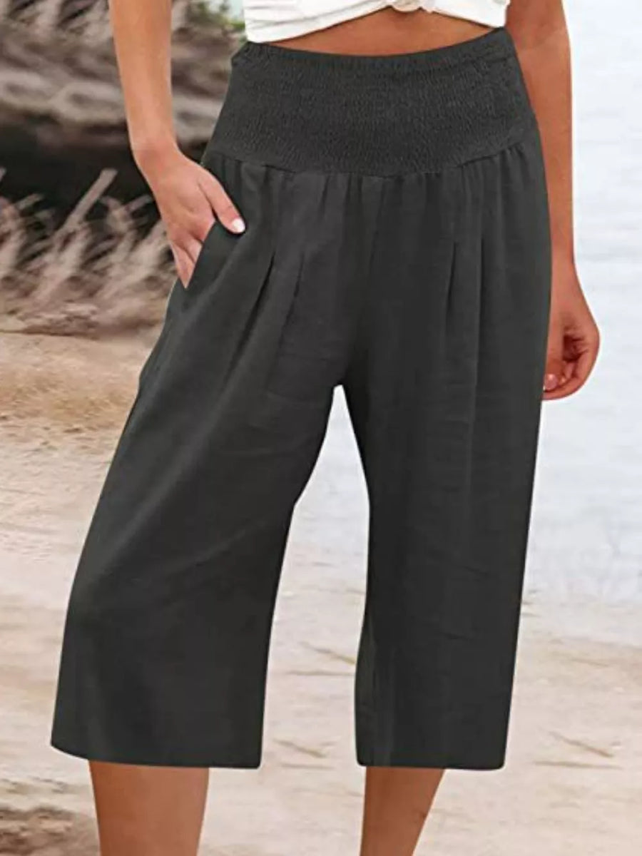 Black linen blend cropped pants with smocked waist and side pockets