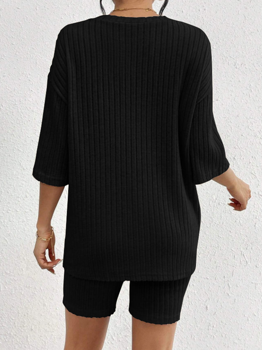 Black ribbed lounge set with relaxed fit top and biker shorts.