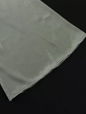 Light grey satin fabric with a finished hem.