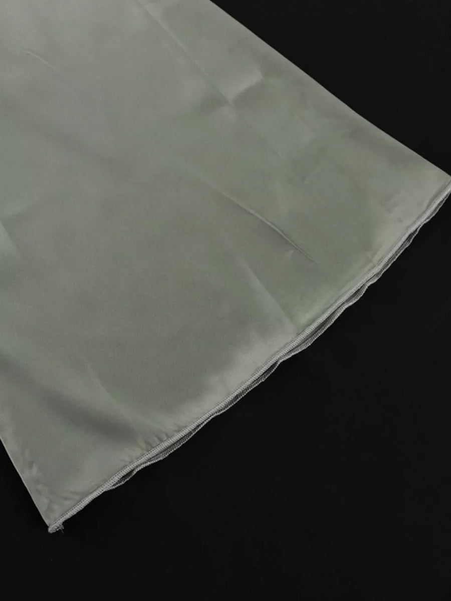 Light grey satin fabric with a finished hem.