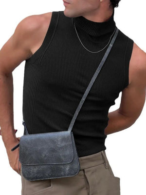 Black ribbed sleeveless turtleneck shirt with a high neck, styled with a crossbody bag.