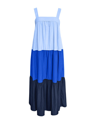 Three-tone wide strap maxi dress in blue, light blue, and navy with a tiered skirt.