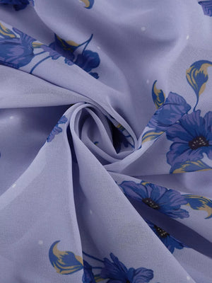 Lightweight lilac fabric with a blue floral print and white polka dots