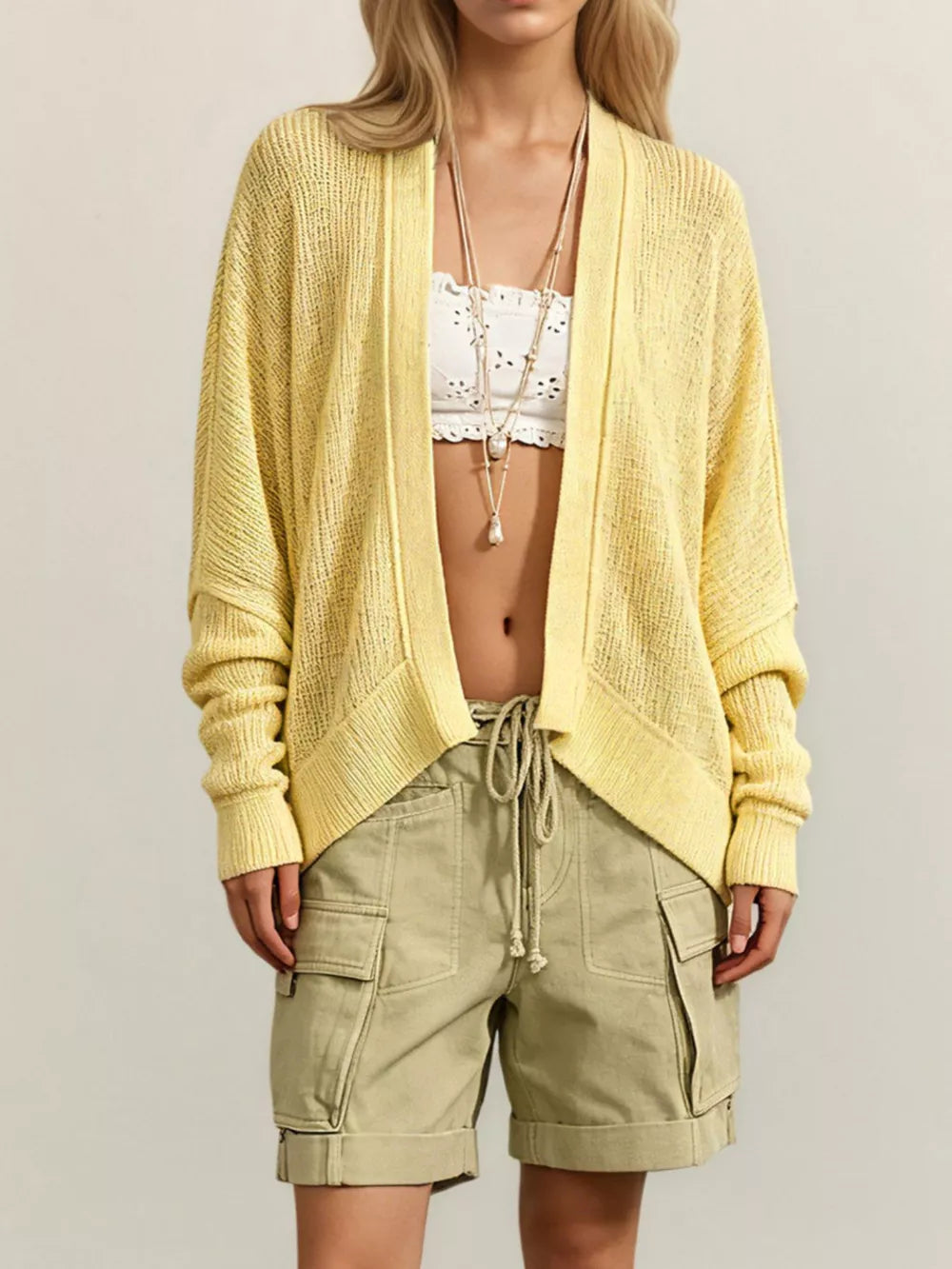 cardigan in pale yellow featuring waffle-knit and relaxed fit