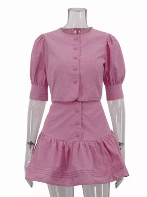 Pink puff sleeve button-up crop top and ruffled mini skirt set