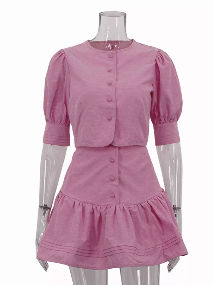 Pink puff sleeve button-up crop top and ruffled mini skirt set