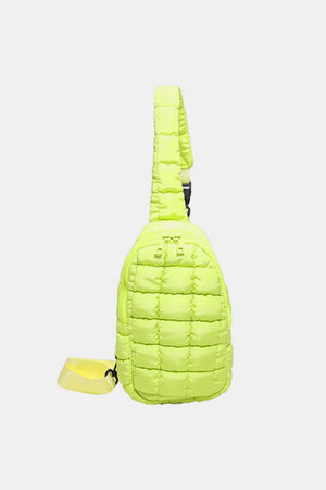 Padded sling bag in Yellow Green with quilted pattern and adjustable strap.