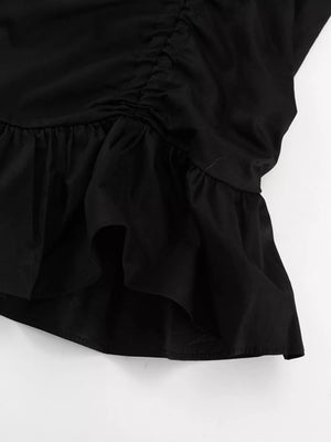 Black ruched top with ruffled hem