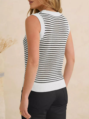 White and black striped knit sweater vest with textured knit and ribbed trim.