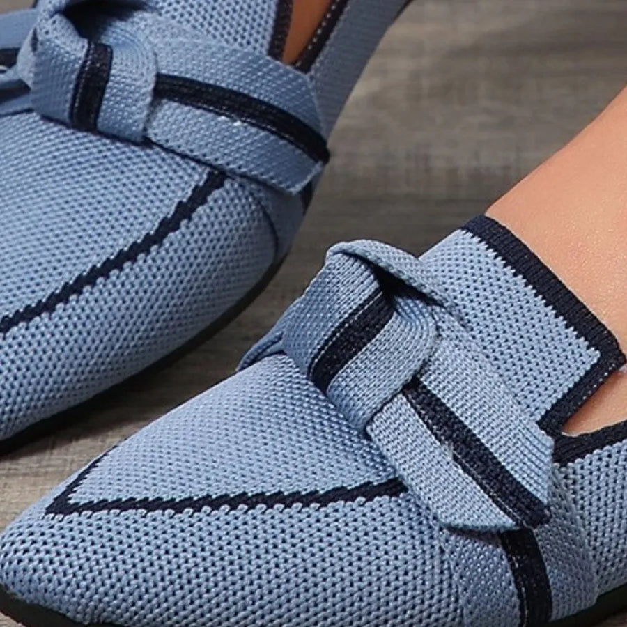 Dusty blue knit loafers with contrast trim and bow detail.