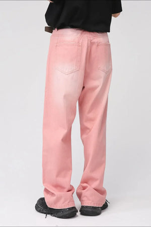 Faded pink wide-leg denim trousers with a casual, relaxed fit.