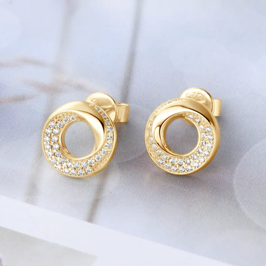 Gold pavé circle stud earrings with delicate cubic zirconia accents.