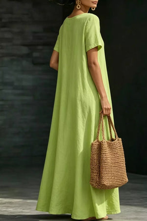 Lime a-line maxi dress with pockets, 100% polyester, short sleeves, crew neck.