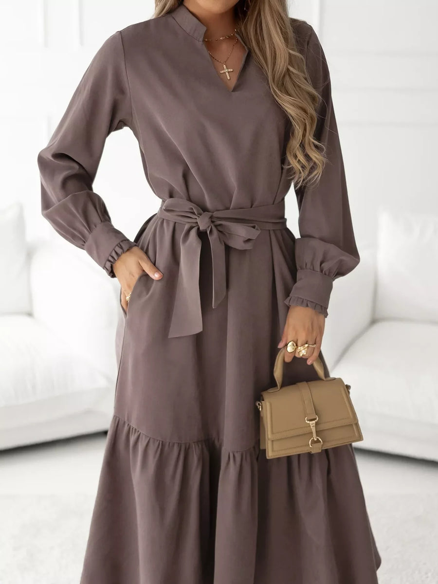 Coffee brown midi dress with ruffle hem, tie waist, and long sleeves.