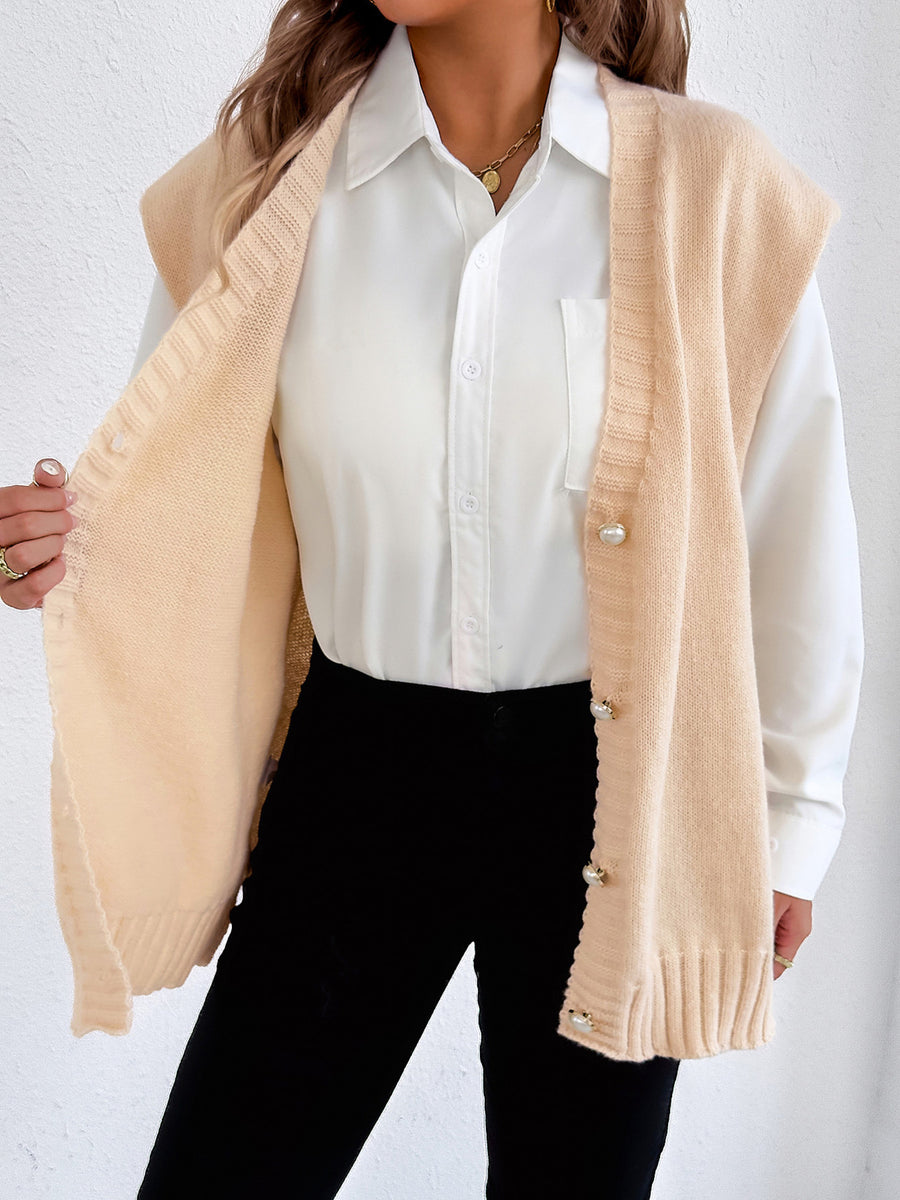 100% polyester Care instructions: Machine wash cold sweater vest in Black with oversized silhouette