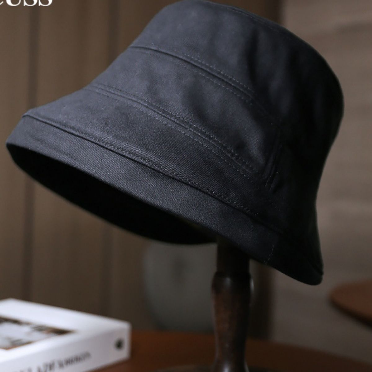 Black cotton sun protection bucket hat with stitched details