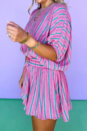 Vibrant pink and teal striped two-piece set with drawstring waist and short skirt