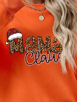 Orange crewneck sweatshirt with leopard print "Mama" and plaid "Claus" text, featuring a Santa hat.