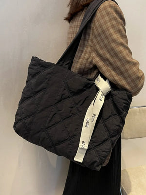 Black diamond quilt nylon tote bag with logo strap detail
