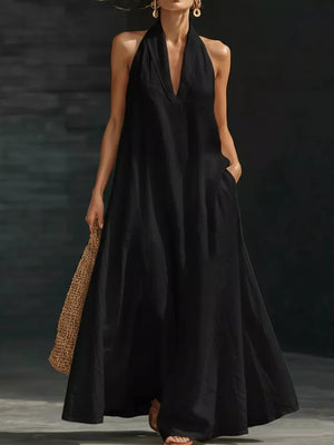 Black halter neck maxi dress with pockets, V-neck, sleeveless, flowing skirt, 100% polyester.