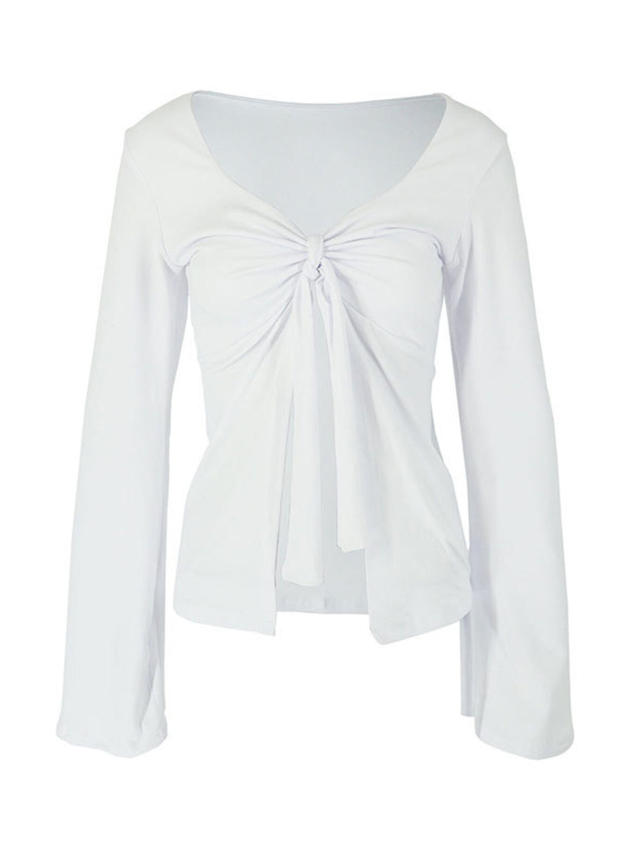 White long sleeve tie-front blouse with a deep V-neckline