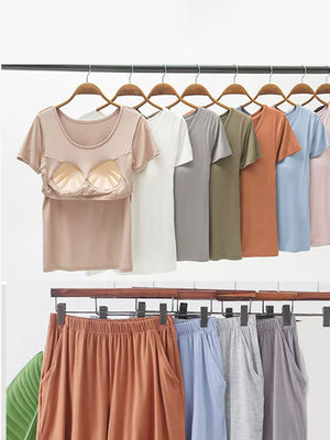 Two-piece pajama set with built-in bra cups and elastic waist shorts in multiple colors.