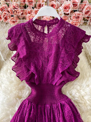 Fuchsia lace maxi dress with ruffled sleeves, high neckline, and smocked waist.