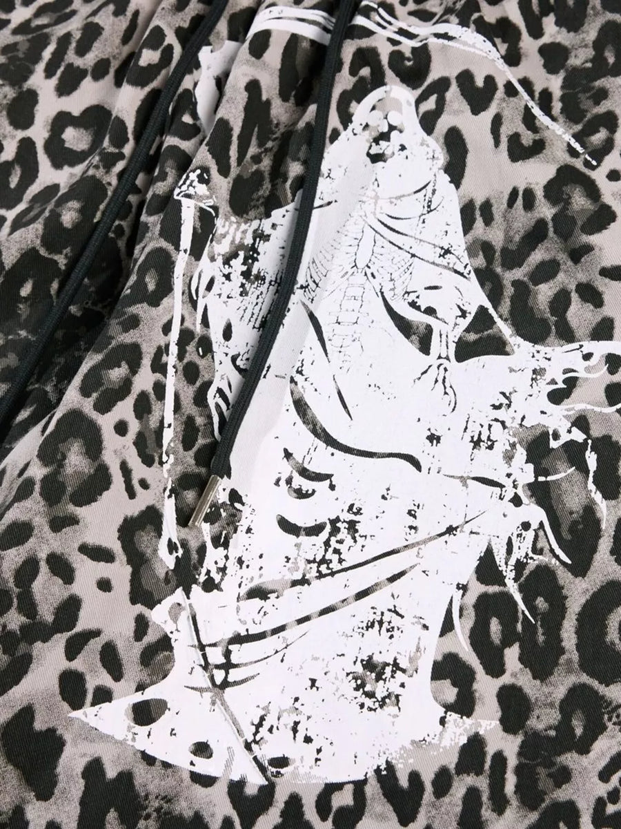 Leopard print cotton sweatpants with drawstring and graphic detail.