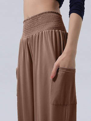 Coffee smocked waist harem pants with pockets and ankle cuffs.