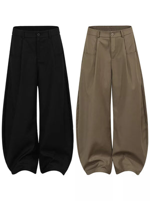 Black and brown wide-leg trousers with pleated front and adjustable waist.