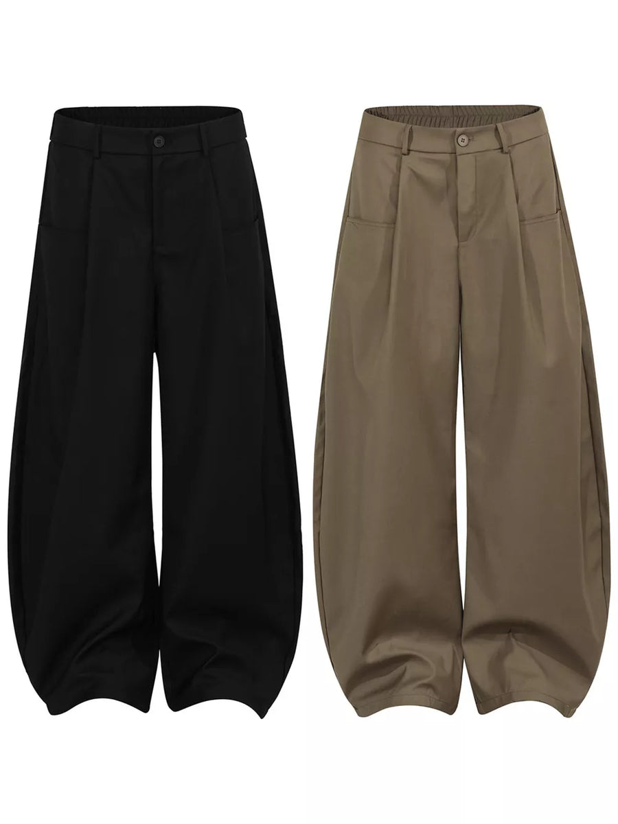 Black and brown wide-leg trousers with pleated front and adjustable waist.