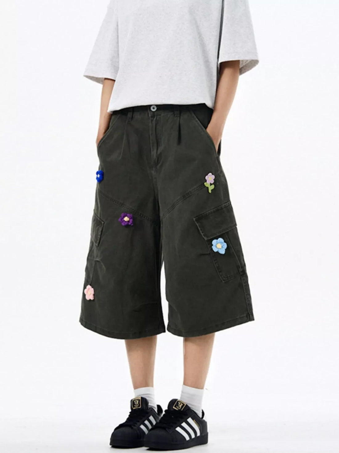 Dark Gray wide-leg cargo shorts with floral appliques and multiple pockets.