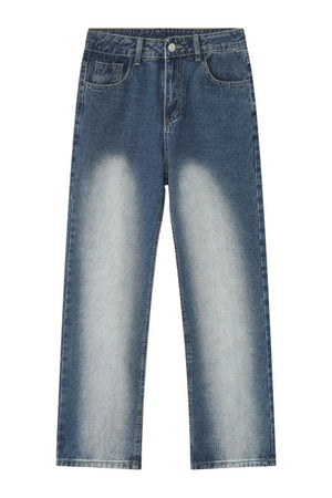 Faded wash baggy jeans in medium blue denim with a relaxed fit and light distressing.